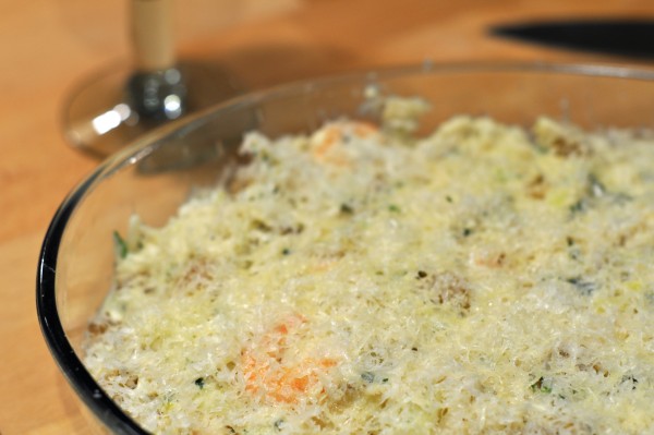Salted cod dish with grated cheese ready for oven