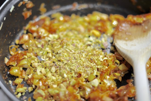 Frying leeks, garlic, onion, tomato puré and pistachios